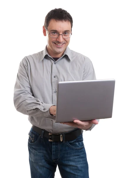 Uomo felice che tiene il computer portatile — Foto Stock