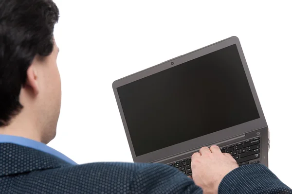 Widok z tyłu człowieka za pomocą laptopa — Zdjęcie stockowe