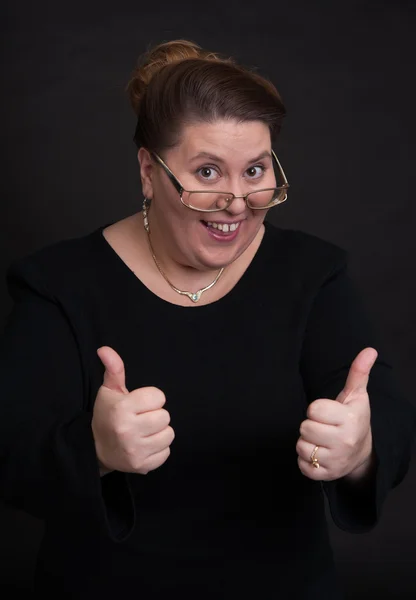 Smiling woman showing hid thumbs up — Stock Photo, Image