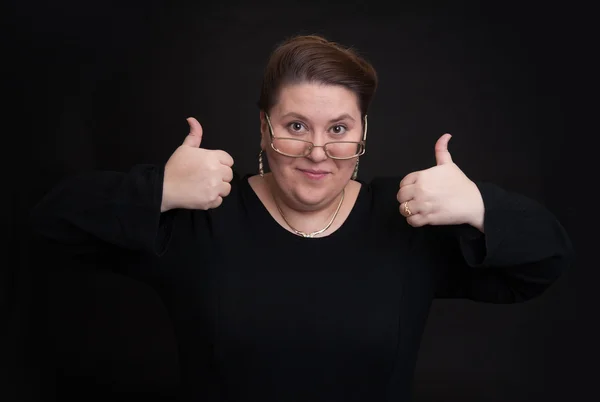 Smiling woman showing hid thumbs up — Stock Photo, Image