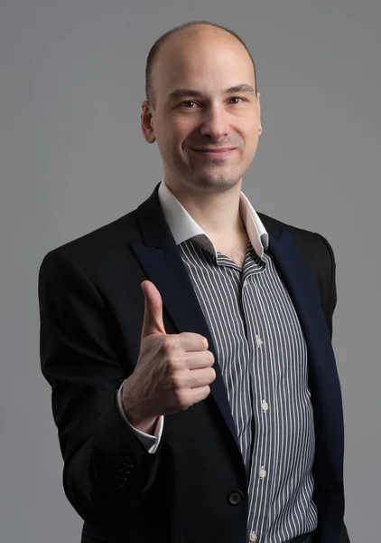 Fashionable man showing his thumb up — Stock Photo, Image