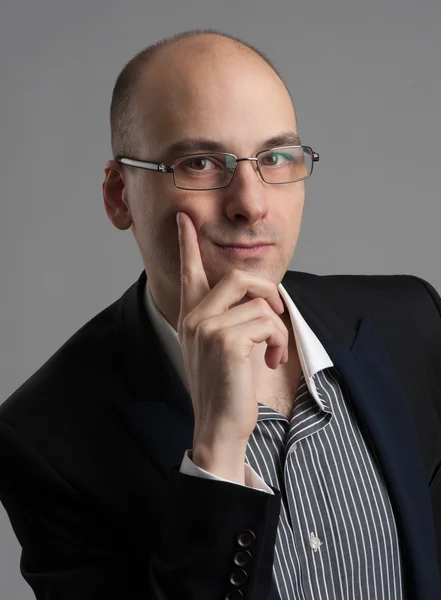 Thoughtful businessman wearing glasses — Stock Photo, Image