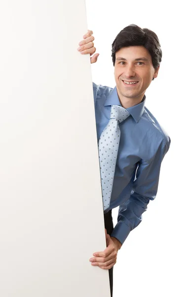 Feliz joven empresario mostrando letrero en blanco — Foto de Stock