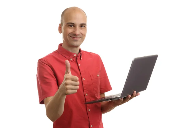 Casual man with laptop showing thumbs up Stock Photo