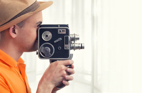Man with retro camera — Stock Photo, Image