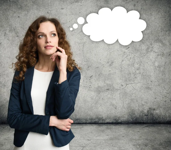 Thinking business woman looking up — Stock Photo, Image