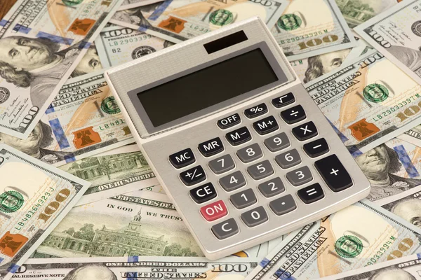 Dinheiro e calculadora — Fotografia de Stock