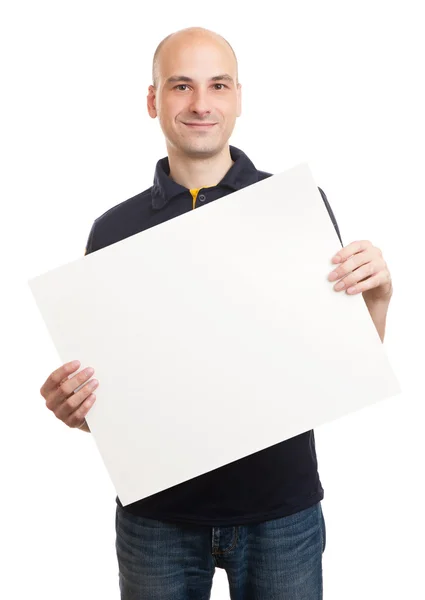 Feliz homem bonito segurando papel em branco — Fotografia de Stock