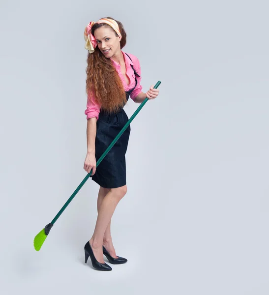 Woman with broom — Stock Photo, Image