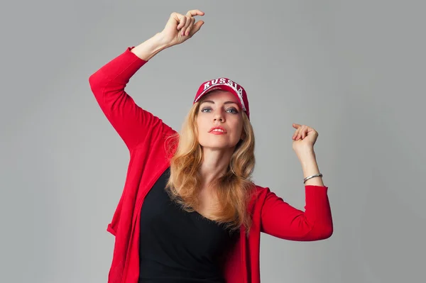 Beautiful young woman in a baseball cap — Stock Photo, Image