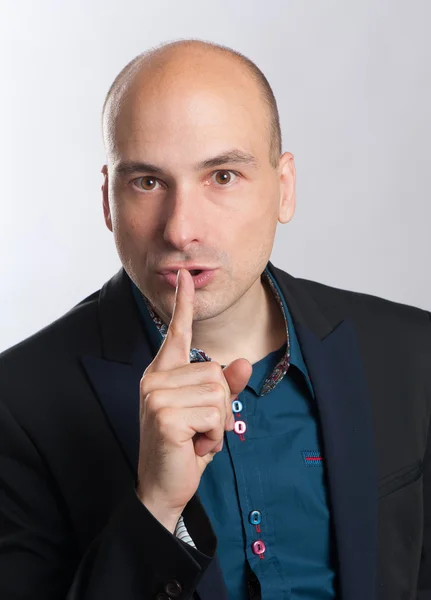 Bald man with a gesture of shh — Stock Photo, Image