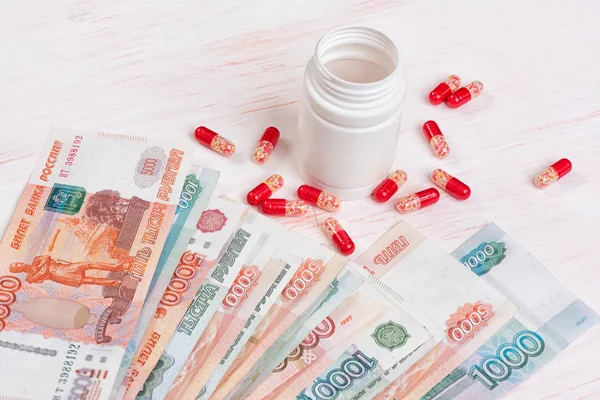 Pills and money. Health care concept — Stock Photo, Image