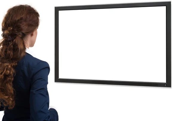 Mujer de negocios mirando en la pantalla en blanco. visión trasera — Foto de Stock