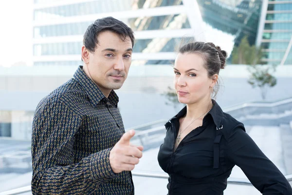 Businessmen and woman in the business center. — Stock Photo, Image