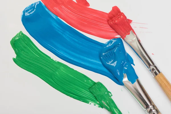 Paint brushes with gouache — Stock Photo, Image