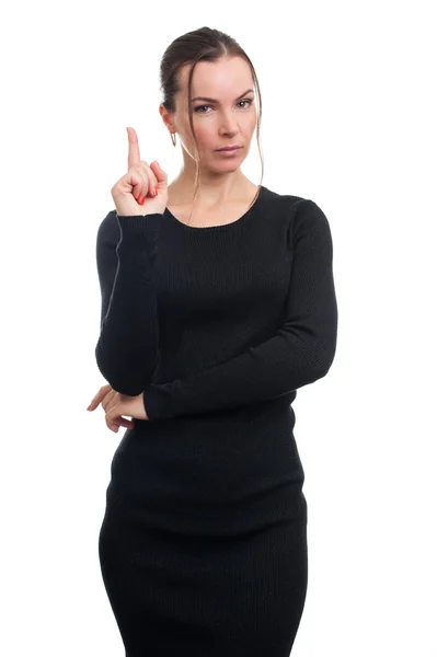 Aantrekkelijke jonge vrouw met haar vinger omhoog — Stockfoto