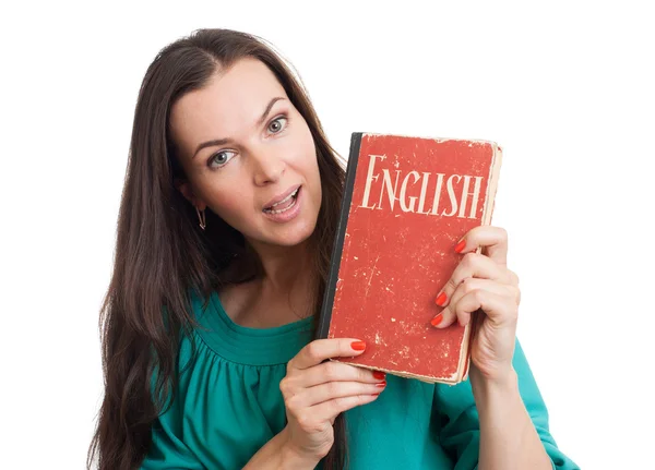 Ung kvinna med en engelsk lärobok — Stockfoto