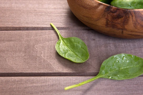 Spinach on a wooden background — Stock Photo, Image