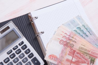 para, hesap makinesi ve defter