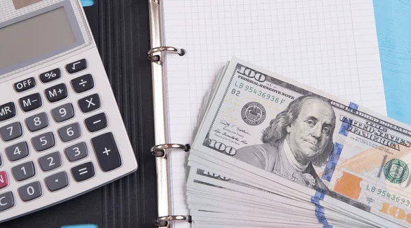 Money, calculator and notebook — Stock Photo, Image