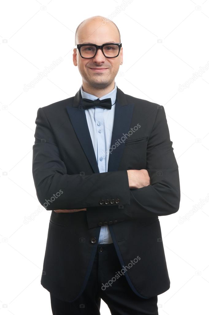 bald man in a suit and bow tie