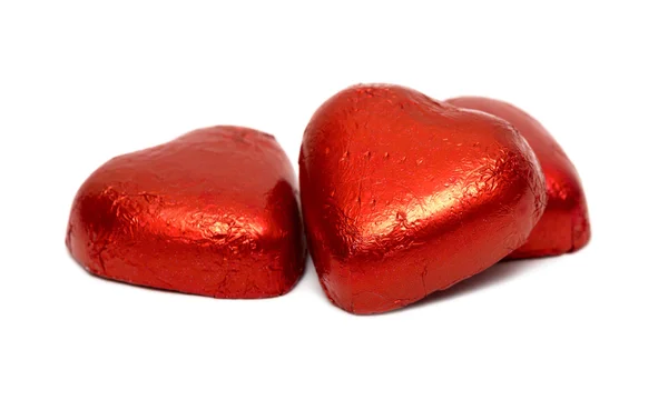 Corazones de chocolate rojo aislados en blanco —  Fotos de Stock