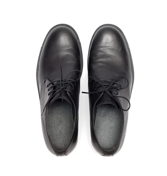 Black men 's shoes on a white background — стоковое фото