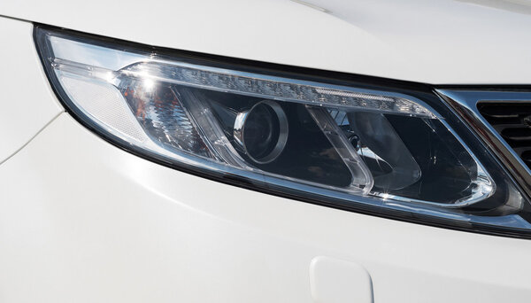 car head lights in silver - closeup