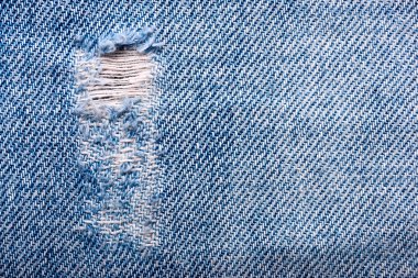 torn old blue jeans background clipart
