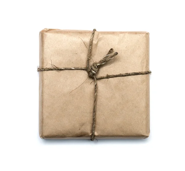 Parcel wrapped with brown kraft paper isolated on white backgrou — Stock Photo, Image