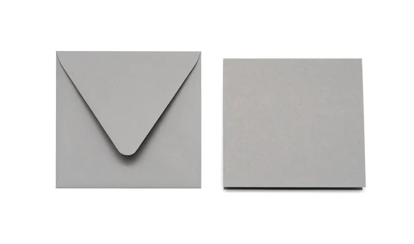 Enveloppe grise et carte sur blanc avec ombre — Photo