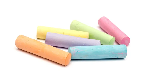 Chalks in a variety of colors arranged on a white background — Stock Photo, Image