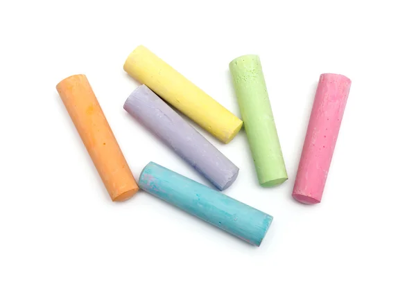 Chalks in a variety of colors arranged on a white background — Stock Photo, Image