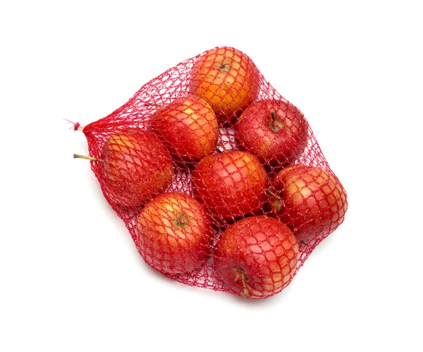 Der Haufen Äpfel, verpackt im roten Netz — Stockfoto