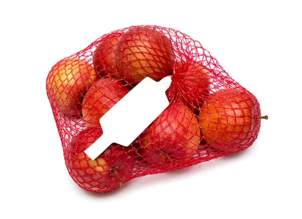 The heap of apples packaged in the red net — Stock Photo, Image