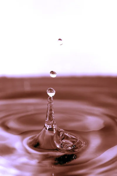 Salpicadura de agua de color — Foto de Stock