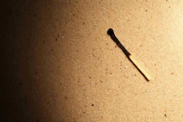 One Burnt Match Sand Background Beam Light — Stock Photo, Image