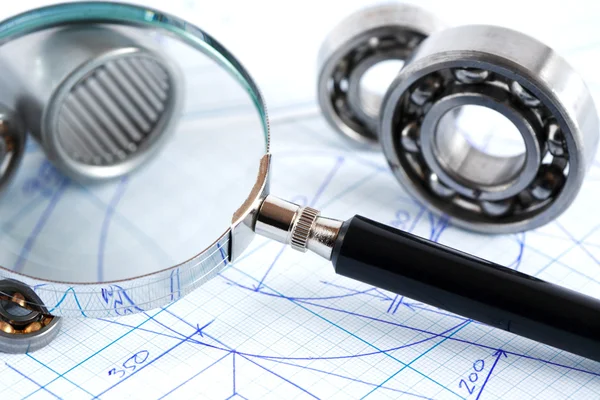 Magnifying Glass And Ball Bearings — Stock Photo, Image