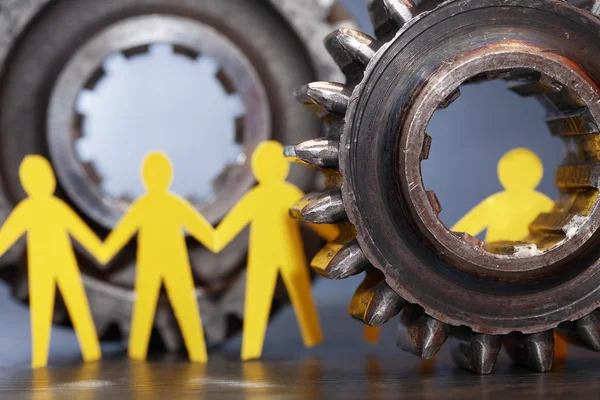 People Between Gears — Stock Photo, Image