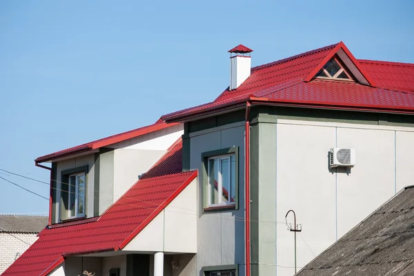 Modern white house with red roof — Stock Photo, Image