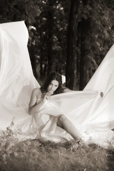 Girl wrapped in white fabric — Stock Photo, Image