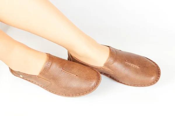 Female legs in moccasins — Stock Photo, Image