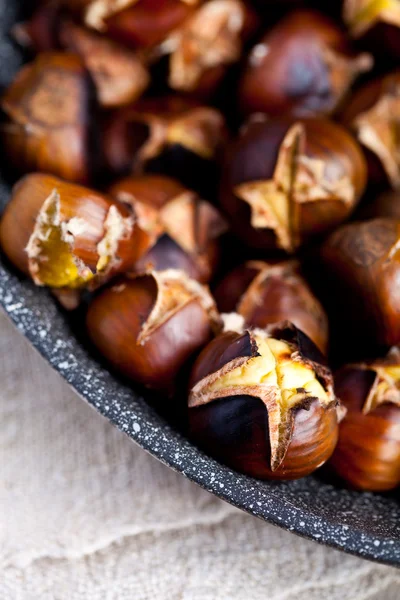 Roasted chestnuts in a pan — Stock Photo, Image
