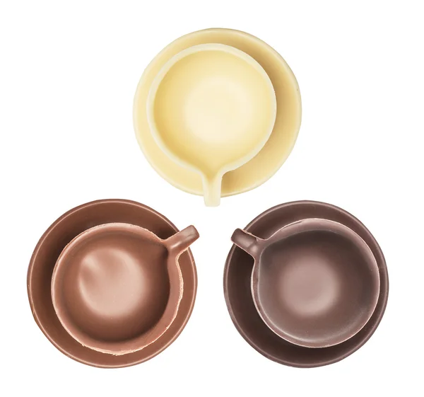 Set van koffiekopje, beker en de schotel gemaakt van melk, zwarte en witte chocolade — Stockfoto