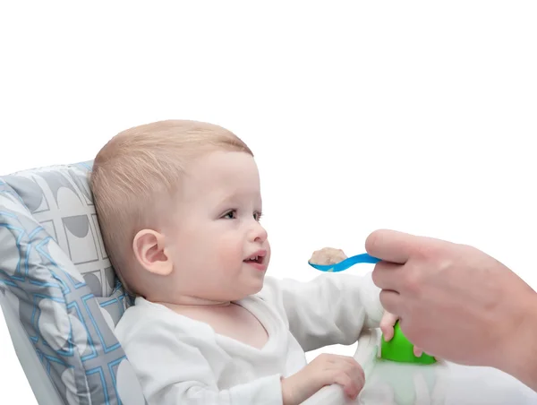 The father feeds with porridge of the one-year-old kid — Stock Photo, Image