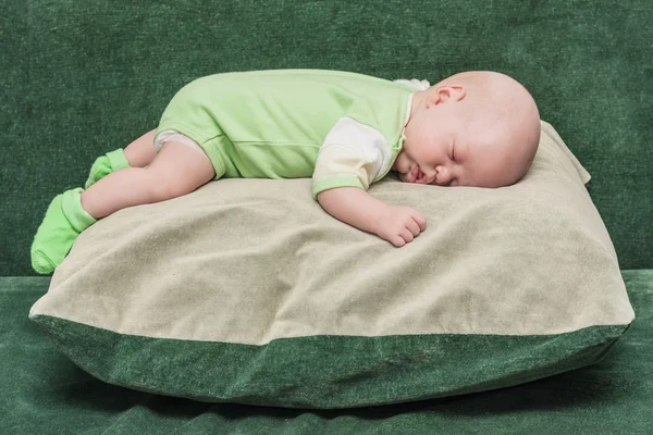 The newborn one-month baby lies on a big pillow — Stock Photo, Image