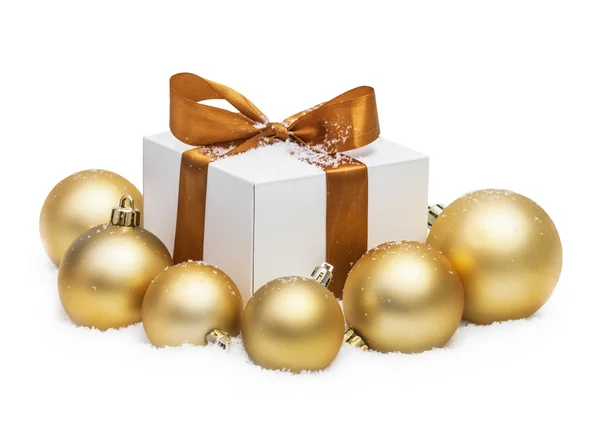 Decorative white gift box with a large gold bow — Stock Photo, Image