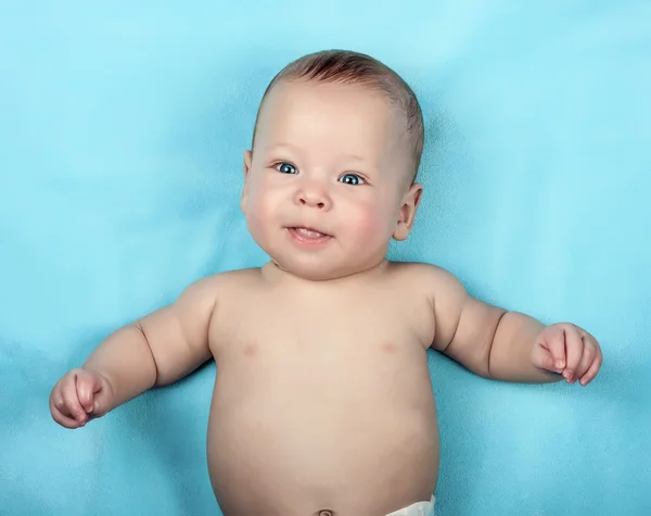 Newborn baby on blue — Stock Photo, Image