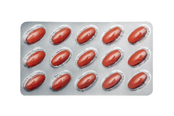 Kırmızı haplar, tabletler, kapsüller paketi — Stok fotoğraf