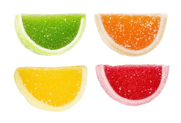 La jalea de fruta roja, amarilla, naranja, verde, segmentos aislados en el blanco — Foto de Stock